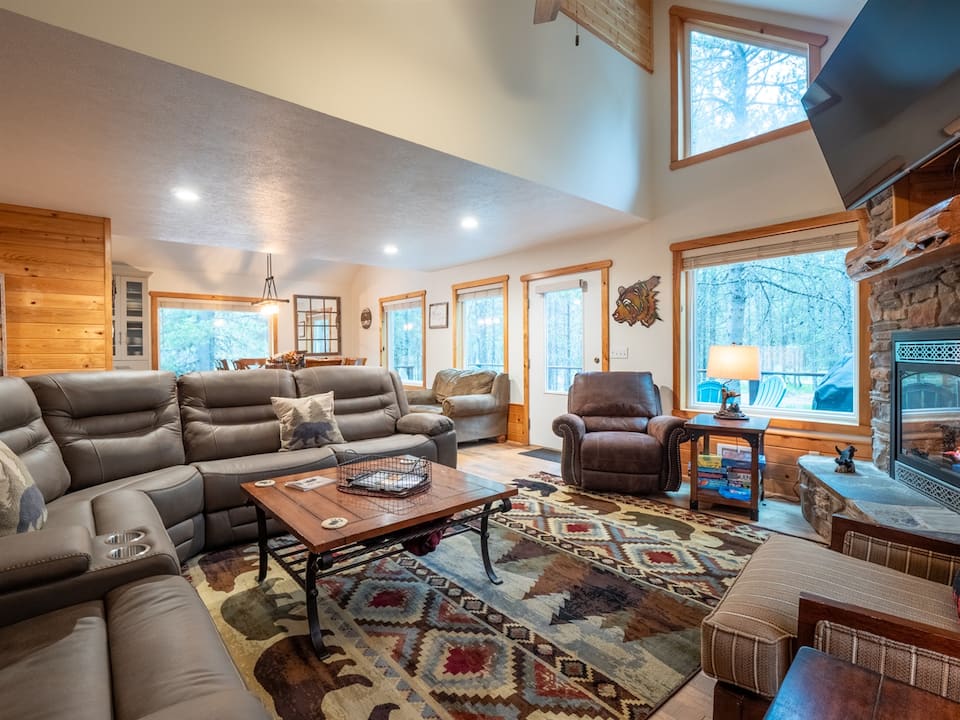 Pine Shadows living room with fireplace and gathering seating